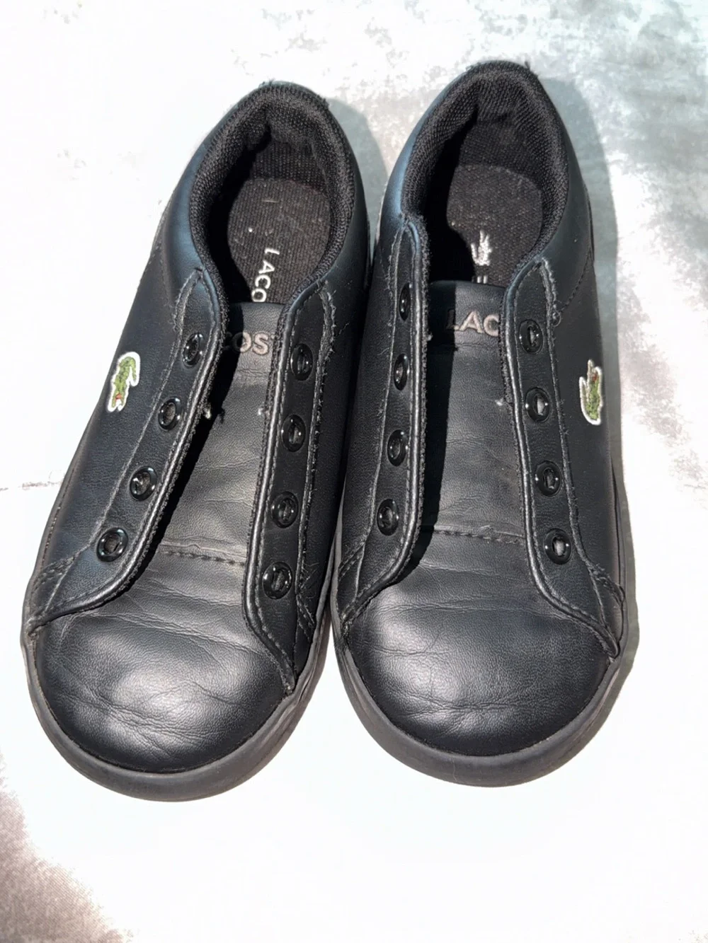 Kid’s Lacoste Black Slip-On Leather Sneakers with Green Croc Emblem